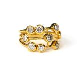 A 14CT GOLD AND DIAMOND CLUSTER RING The arrangement of round cut stones, marked (size O). (approx
