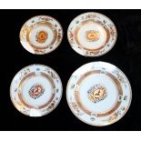 A SET OF FOUR LARGE 18TH CENTURY CHINESE ARMORIAL PORCELAIN CHARGER DISHES Each having a family