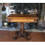 A VICTORIAN FIGURED WALNUT CARD TABLE Gothic reform style, the fold over top enclosing a green baize