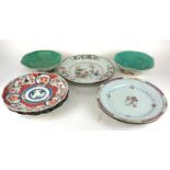 A PAIR OF 18TH CENTURY CHINESE EXPORT FAMILLE ROSE PLATES Painted in enamels with flowering