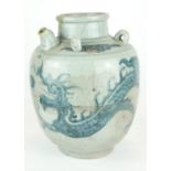 A CHINESE PROVINCIAL MING PERIOD RICE WINE JUG Decorated with a four toe dragon on a pale blue