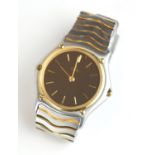EBEL, SPORTSWAVE, A STAINLESS STEEL AND 18CT GOLD GENT'S WRISTWATCH Having a circular gold bezel and