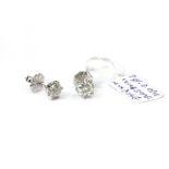A PAIR OF 18CT WHITE GOLD AND DIAMOND STUD EARRINGS Each set with a single round cut stone. (
