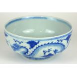 A CHINESE BLUE AND WHITE PORCELAIN 'FIVE TOE DRAGON' BOWL Decorated with dragons chasing a flaming