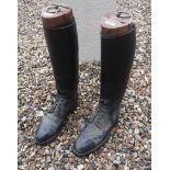 A PAIR OF BLACK LEATHER RIDING BOOTS WITH WOODEN TREES Bearing label 'Green Street Military and