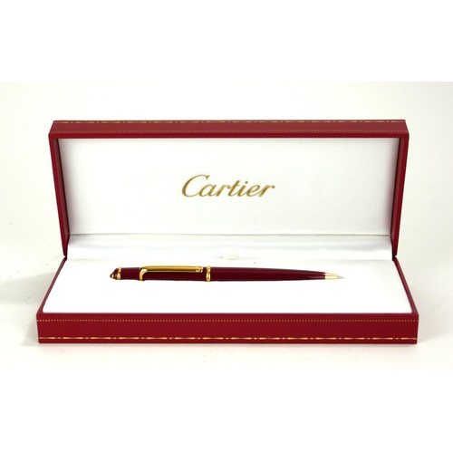 CARTIER, A CASED FULL SIZE GOLD PLATED STYLO DIABOLO BALLPOINT PEN Bordeaux finish with cabochon cut - Image 2 of 3