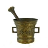 A 20TH CENTURY BRASS PESTLE AND MORTAR Having twin handles and embossed '1825'. (approx 10cm)
