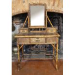 A VICTORIAN BAMBOO AND LACQUERED DRESSING TABLE Fitted with an arrangement of three drawers, along