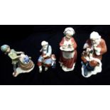 LLARDRO, A COLLECTION OF FOUR CHRISTMAS PORCELAIN FIGURES To include 'Santa's Magical Workshop