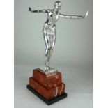 AN ART DECO STYLE SILVERED BRONZE STATUE Dancing girl in Egyptian dress, on rouge marble base. (