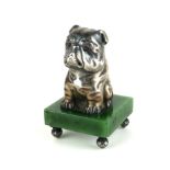 A RUSSIAN SILVER AND NEPHRITE JADE BULLDOG PAPERWEIGHT Seated pose with garnet eyes, bearing '