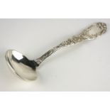 TIFFANY AND CO., AN EARLY 20TH CENTURY AMERICAN STERLING SILVER LADLE Having an embossed Art Nouveau