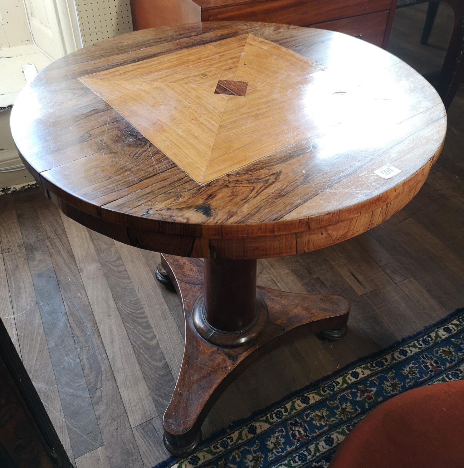 A 19TH CENTURY FRENCH ROSEWOOD SUPPER TABLE The inlaid circular top raised on a turn cannon barrel
