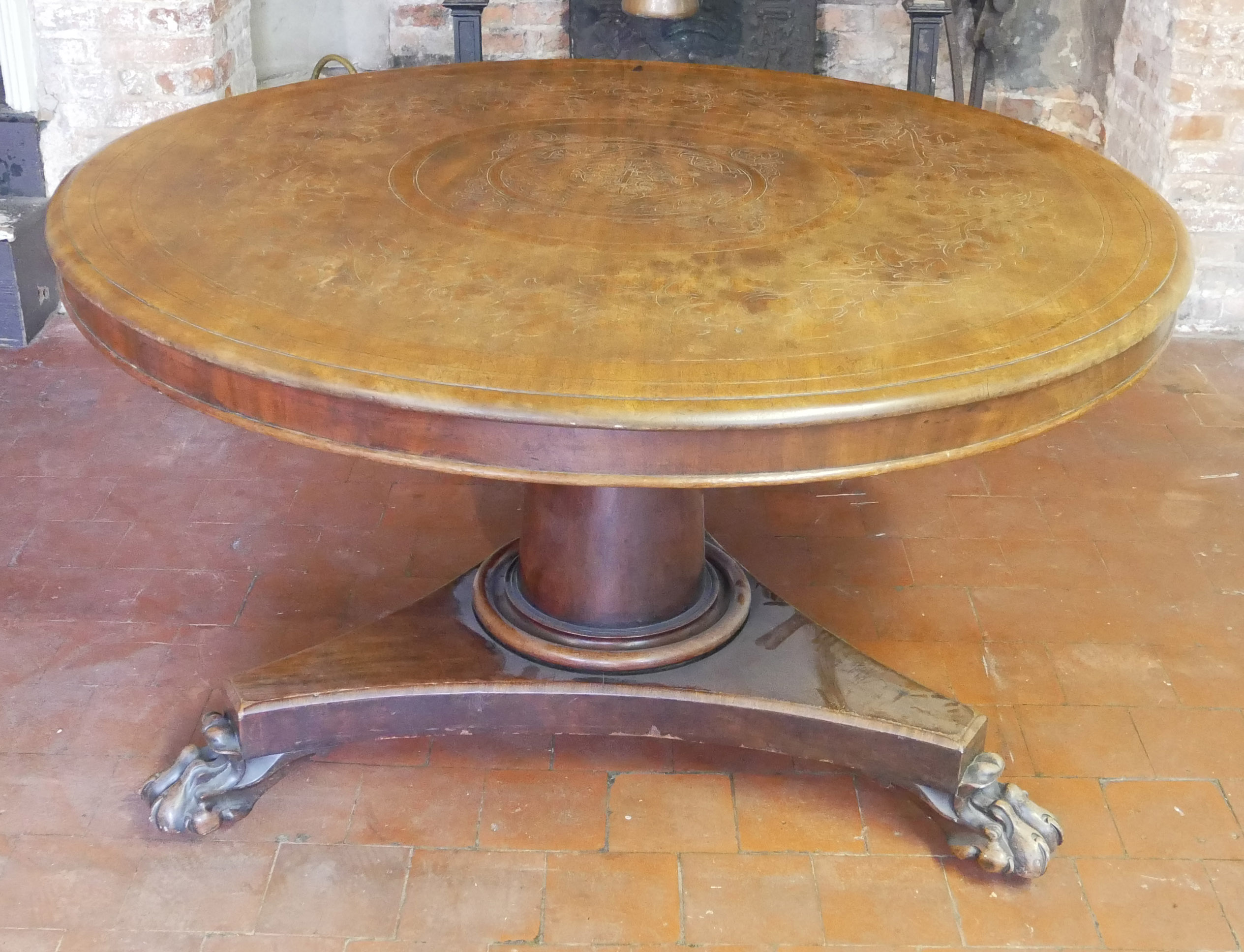 A VICTORIAN MAHOGANY CIRCULAR BREAKFAST TABLE The floral carved surface raised on a substantial