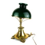 A LATE 19TH/EARLY 20TH CENTURY BRASS AND COLOURED GLASS TABLE LAMP Having a dome form green glass