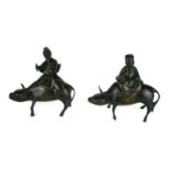 A PAIR OF 19TH CENTURY CHINESE BRONZE AND SILVER INLAID INSENCE BURNERS Elder scholars seated on a