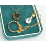 A VINTAGE 9CT GOLD, SAPPHIRE AND RUBY PENDANT NECKLACE Heart form with opposing round cut stones