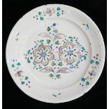 AN 18TH CENTURY FAIENCE POTTERY CHARGER/DISH Hand painted floral decoration. (approx 30cm)