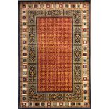 A GOOD QUALITY INDIAN CZAR WOOLLEN RUG With central stylised floral field contained in a segmented