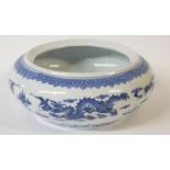 A CHINESE BLUE AND WHITE PORCELAIN DRAGON BOWL Decorated with opposing dragons chasing a flaming