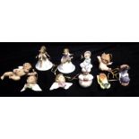 LLADRO, A COLLECTION OF TEN PORCELAIN CHRISTMAS TREE ORNAMENTS Comprising two hand bells, a genie