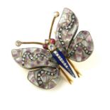 AN ART NOUVEAU YELLOW METAL, DIAMOND AND RUBY BUTTERFLY BROOCH Set with ruby eyes, pink glass