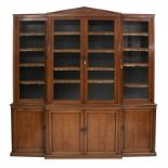 A LARGE EARLY 19TH CENTURY REGENCY ROSEWOOD BREAKFRONT LIBRARY BOOKCASES With architectural pediment