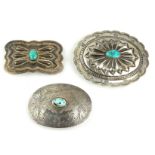 A VINTAGE STERLING SILVER AND TURQUOISE BELT BUCKLE Oval form with cabochon cut stone and engraved