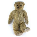 AN EARLY 20TH CENTURY MOHAIR TEDDY BEAR Having black button eyes, long snout and elongated paws. (