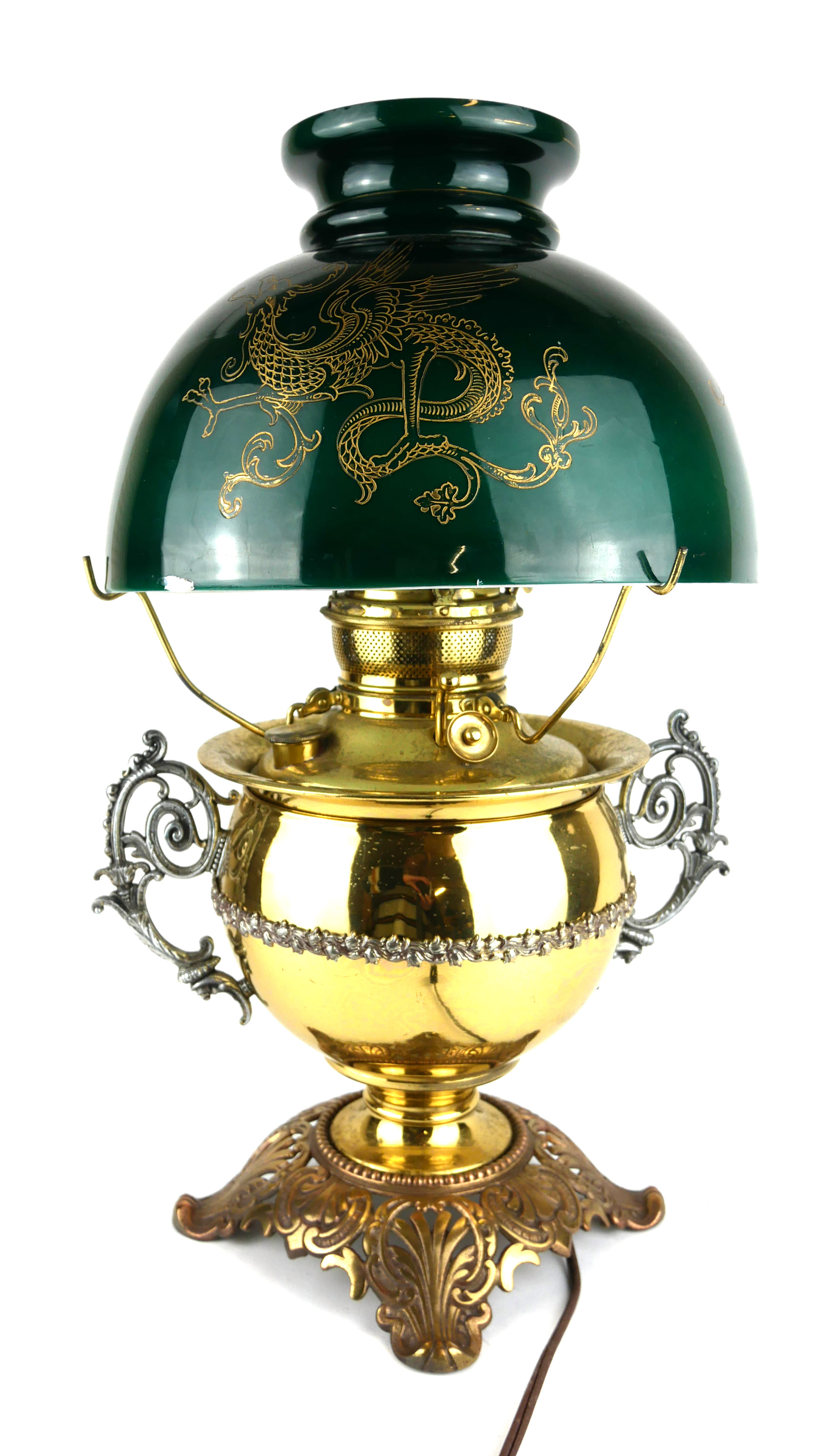 A LATE 19TH/EARLY 20TH CENTURY BRASS AND GREEN GLASS TABLE LAMP Having a dome form green glass shade