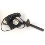 BAKELITE, AN EARLY 20TH CENTURY TELEPHONE Having a dial up mechanism and pullout drawer, marked '