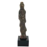 A CHINESE BRONZE GODDESS STATUE Standing pier wearing long flowing robes, on a black perspex
