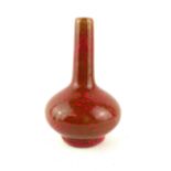 A CHINESE FLAMBÉ GLAZED PORCELAIN BALUSTER VASE With red oxidised glaze, bearing square Chinese