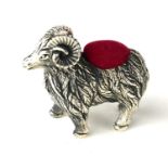 A STERLING SILVER NOVELTY 'RAM' PIN CUSHION Standing pose, with red velvet cushion. (approx 3.5cm)