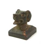 A CHINESE BRONZE CANINE DESK SEAL Having the bust of a dogs head with archaic form seal to base. (