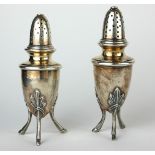 AN UNUSUAL PAIR OF EARLY 20TH CENTURY CONTINENTAL WHITE METAL PEPPERETTES Having dome form lids,