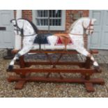 A RARE DOUBLE HEADED WOODEN ROCKING HORSE With real hair mane and leather tack, on pine base. (170cm