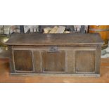 AN 18TH CENTURY OAK COFFER With rise and fall top above plane panels. (119cm x 46cm x 45cm)