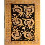 A GOOD QUALITY SAVONNERIE INDIAN HEAVY RUG With central floral field on a black ground contained