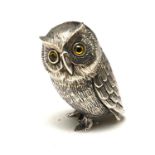 A STERLING SILVER NOVELTY 'OWL' FIGURE Standing pose with glass set eyes. (approx 3.5cm)