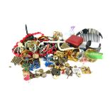 A COLLECTION OF VINTAGE COSTUME JEWELLERY Including gold plated bangles, earrings and brooches,