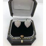 A PAIR OF 18CT WHITE GOLD HEART SHAPED EARRINGS encrusted with pave set diamonds .8cm