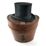 AN EARLY 20TH CENTURY BEAVER SKIN TOP HAT AND LEATHER HAT BOX Hat marked 'Albert Thrussell,