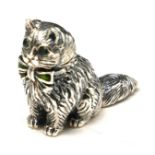 A STERLING SILVER AND ENAMEL NOVELTY 'CAT' FIGURE Seated pose with glass set eyes and enamel bow