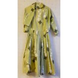 A VINTAGE MONTEGO BAY COTTON DRESS AND SHOULDER JACKET.