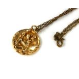 A VINTAGE 14CT GOLD ST. CHRISTOPHER MEDALLION PENDANT NECKLACE Having an embossed figural design