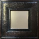 A FAUX CROCODILE SKIN LEATHER FRAMED MIRROR With central bevelled plate. (71cm x 71cm)