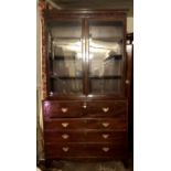 A GEORGIAN MAHOGANY SECRÈTAIRE BOOKCASE With two glazed doors enclosing adjustable shelves above a