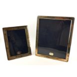 TWO STERLING SILVER PHOTOGRAPH FRAMES Plain form with blue velvet easel backs, in original boxes,