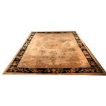 A LARGE CHINESE HEAVY WOOLLEN RUG With central dragon design and Royal black running border. (approx